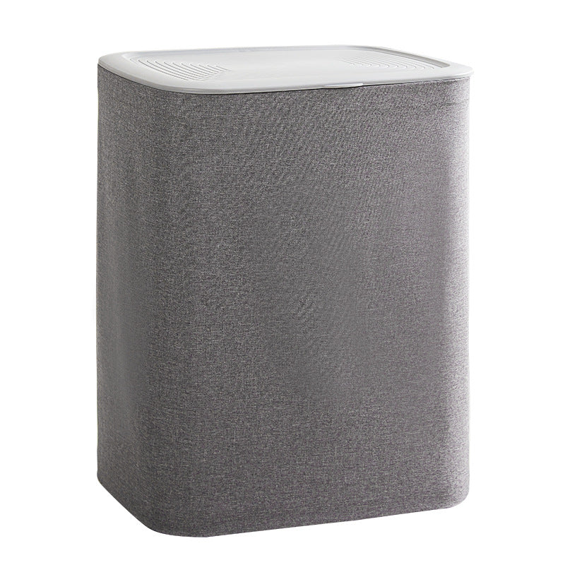 A covered dirty clothes basket