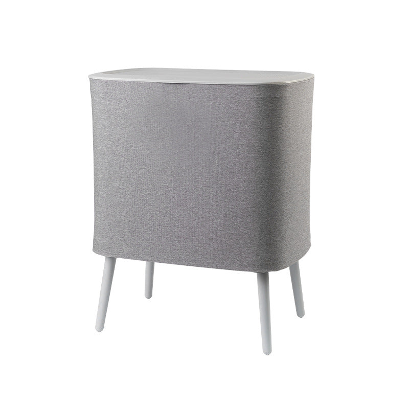 A covered dirty clothes basket