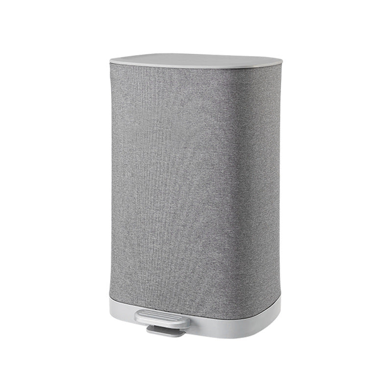 A covered dirty clothes basket