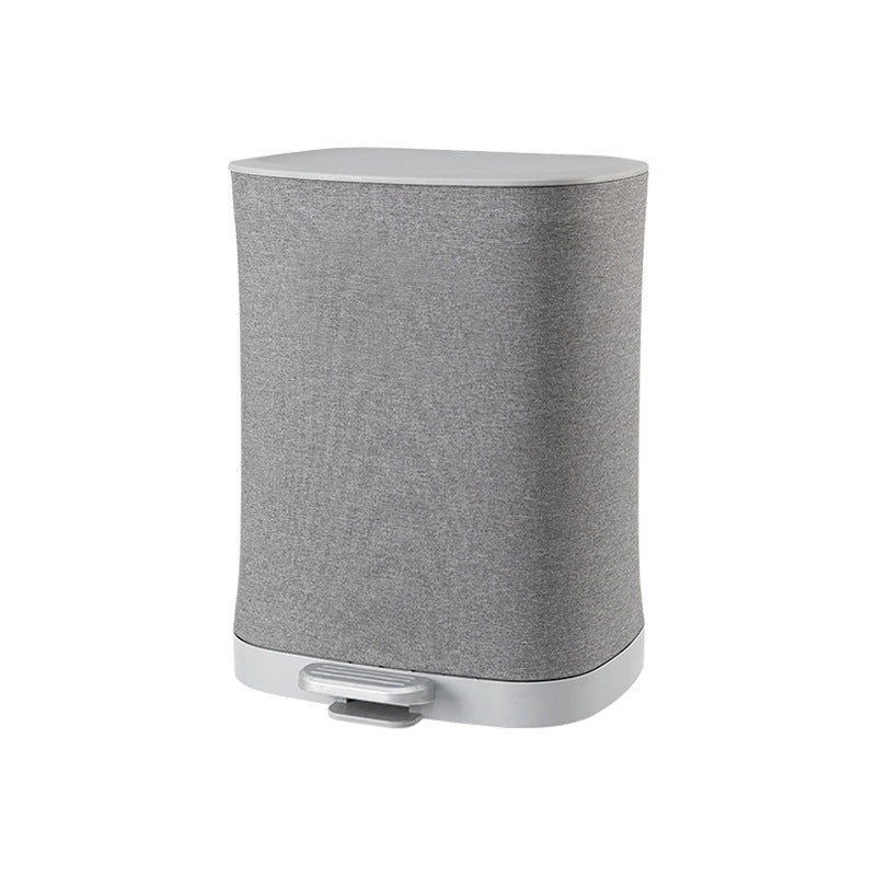 A covered dirty clothes basket